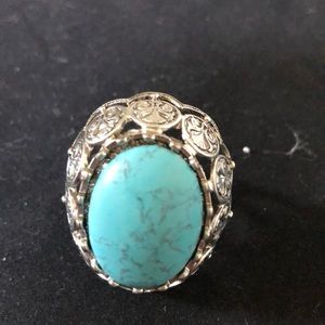 Turquoise ring with silver floral motif